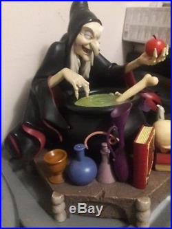 Evil Queen from Snow White figurine/ size is compared to nickel in first picture