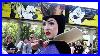 Meeting_The_Evil_Queen_From_Snow_White_At_Disneyland_With_Mickey_Mouse_Monorail_Passing_By_01_wuf